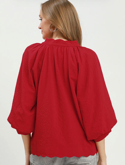 Red Textured Scalloped Top with three-quarter sleeves and detailed hem, available in sizes XS–XL.