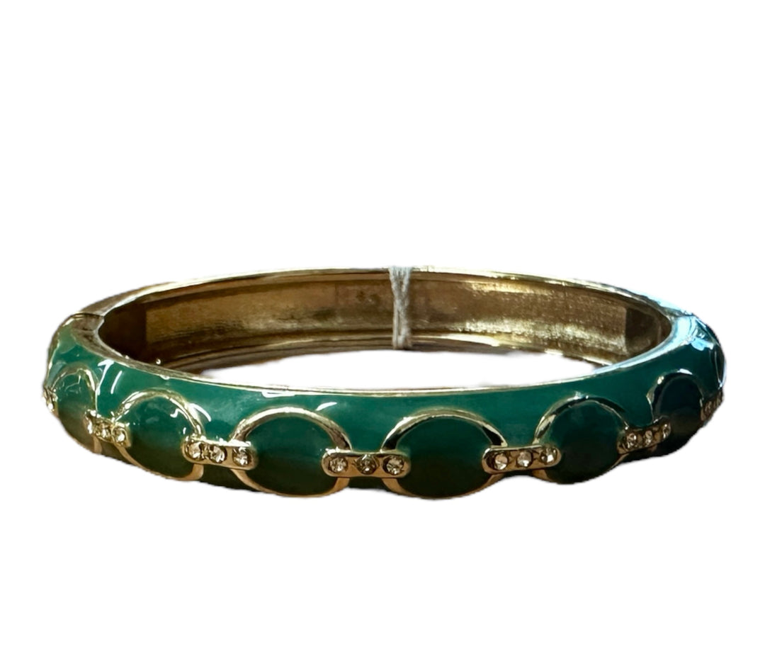 The Bella Bracelet is a gold bangle with green enamel round accents and small clear rhinestones. Sizes: S, M, L.