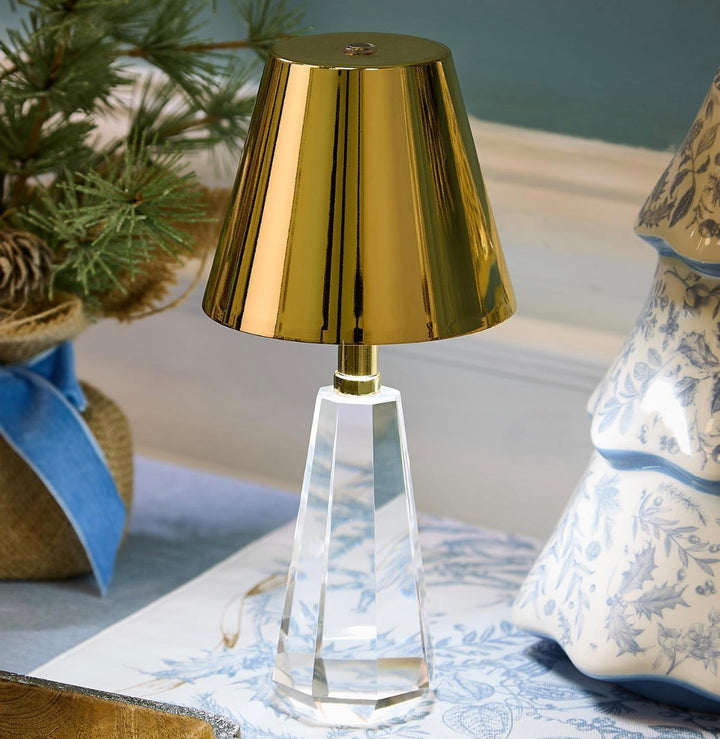 Cordless LED table lamp with shiny gold shade and clear faceted crystal glass base. Sizes available: small, medium, large.