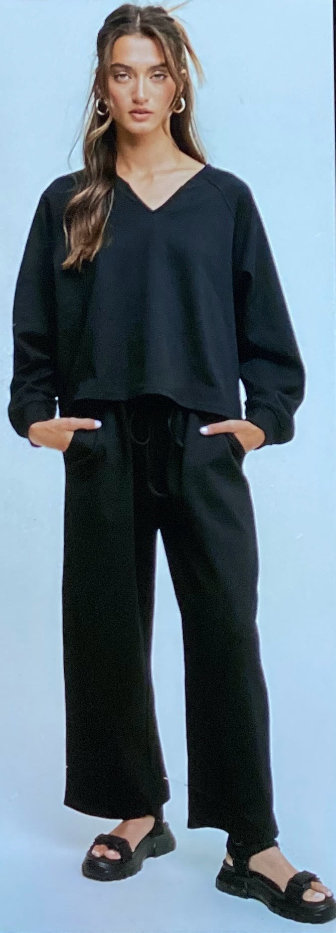 The product is a black V-Neck Sweatshirt and Pants Set with drawstrings. Available sizes include small, medium, large, and extra-large.