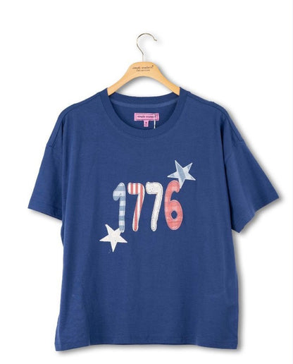 1776 Blue Tee with "1776" in red, white, and blue plus two stars. Soft cotton. Sizes S–XXL.