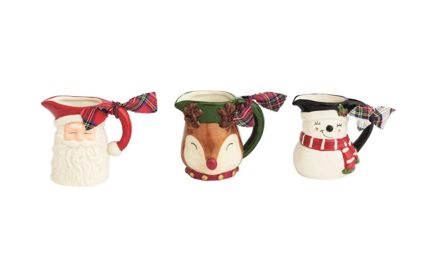 Hand-painted Santa, reindeer, and snowman pitcher bud vases with plaid ribbons.