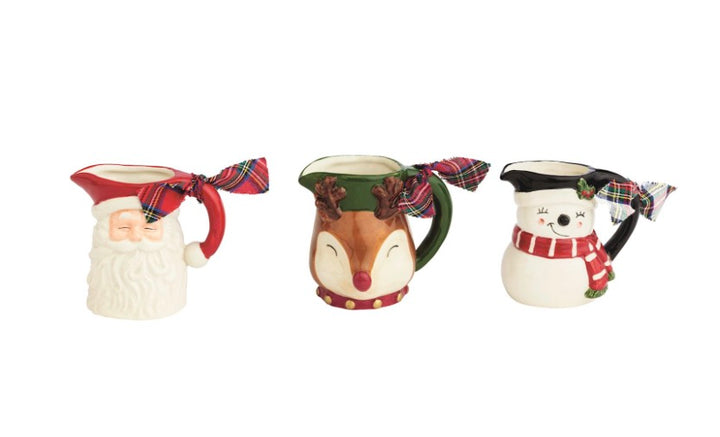 Hand-painted Santa, reindeer, and snowman pitcher bud vases with plaid ribbons.