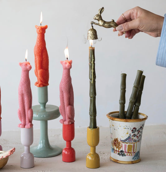 Pewter rabbit-shaped candle snuffer in antique gold finish; available in small, medium, and large sizes.
