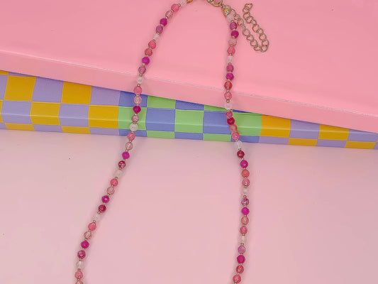 The Candy Bead Gemstone Necklace features pink and white glass beads; available in 16", 18", and 20" lengths.