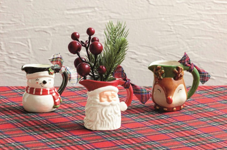 Set of three hand-painted snowman, Santa, and reindeer bud vases with plaid ribbons.