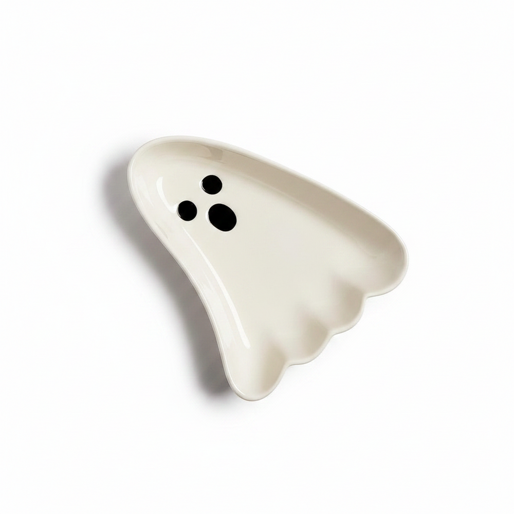 Ghost Bowls: white ceramic dishes shaped like friendly ghosts with two black eyes and a black mouth. Available in multiple sizes.