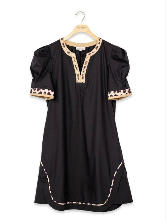 The Wild Side Puff Sleeve Dress features a short black silhouette, puffed short sleeves, tan trim, and decorative dark patterns on the cuffs and neckline. Available in sizes XS-XL.