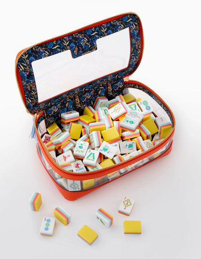 Zippered orange case with floral-print lining containing colorful Pippa Mahjong Tiles. Available in small, medium, and large sizes.