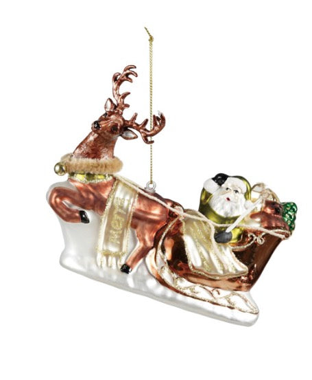 Hand-painted glass Santa’s sleigh and reindeer ornament featuring a glittered “merry” sash.