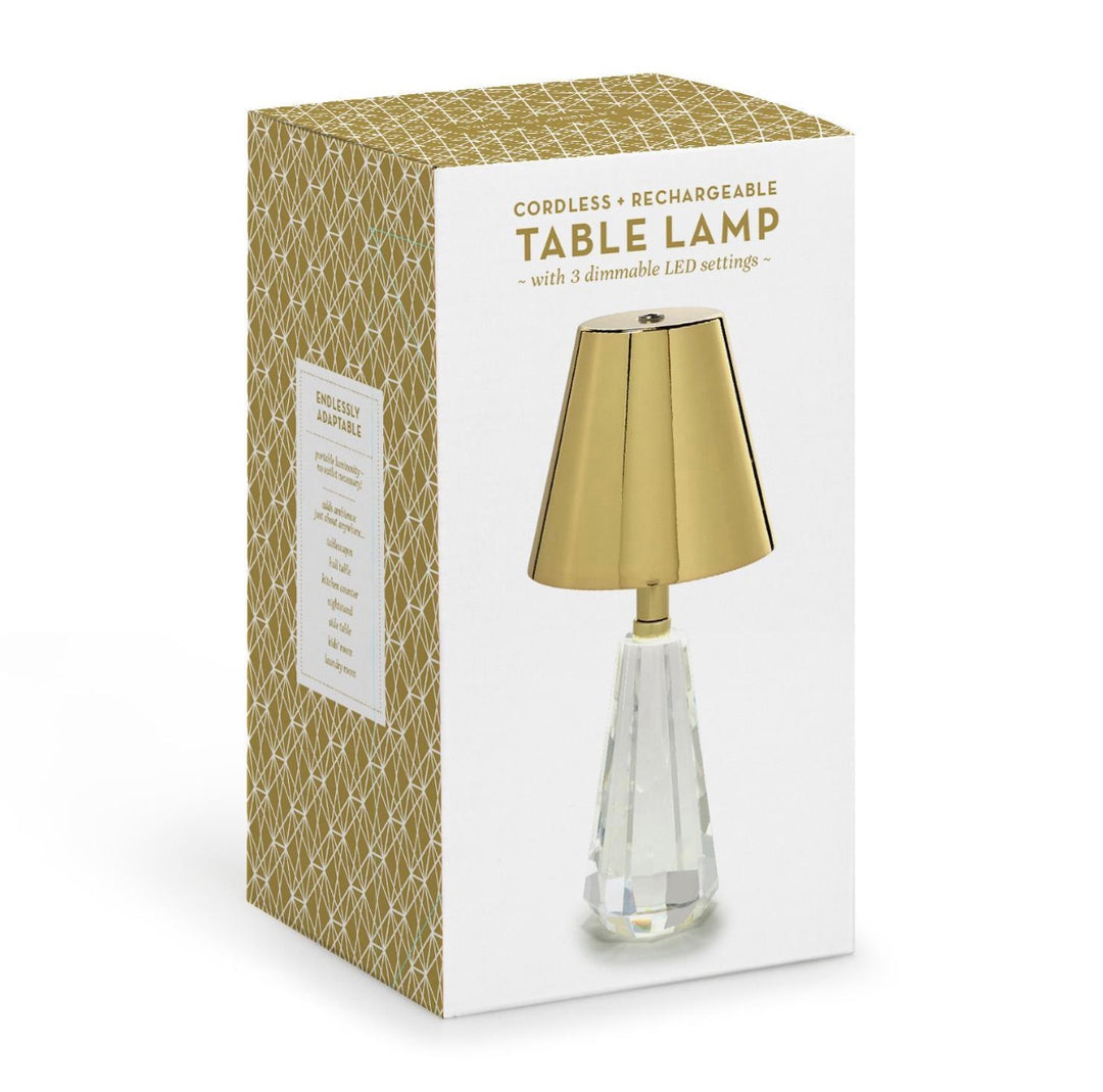 Box for Metallic Crystal LED Cordless Table Lamp, featuring three dimmable settings and a rechargeable design. The lamp has a gold shade with a clear crystal glass base. Box displays a gold geometric side pattern. Sizes available: Small, Medium, Large.