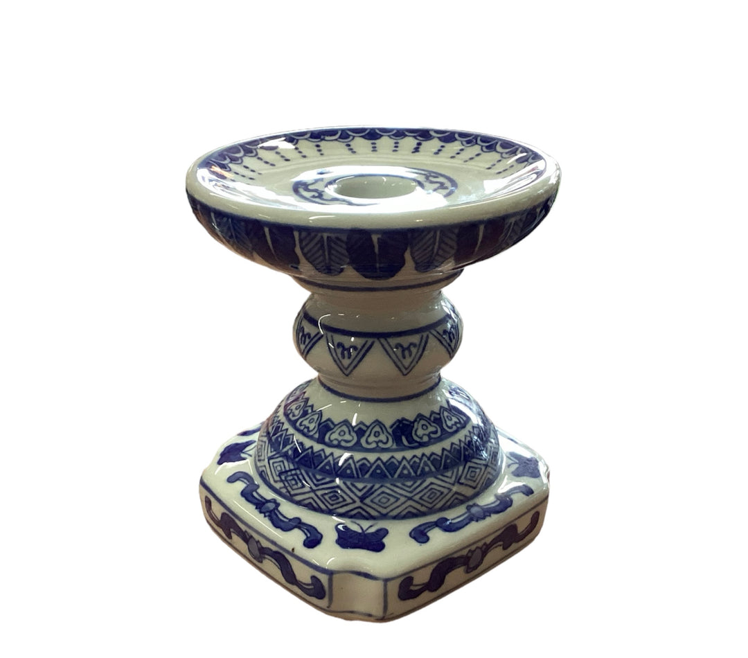 Decorative ceramic candleholder with blue patterns on cream, ornate base, wide shallow top. Available in 2", 4", and 6" sizes.
