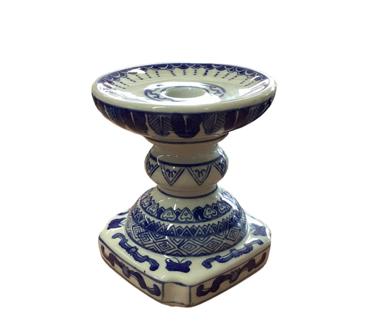Decorative ceramic candleholder with blue patterns on cream, ornate base, wide shallow top. Available in 2", 4", and 6" sizes.