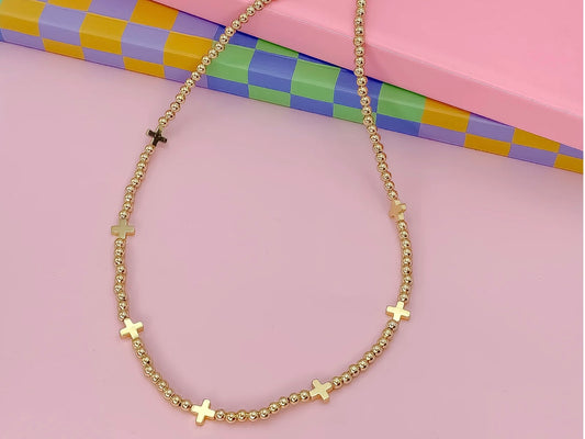 Beaded gold Golden Grace Necklace with small cross charms. Available in 16", 18", and 20" lengths.