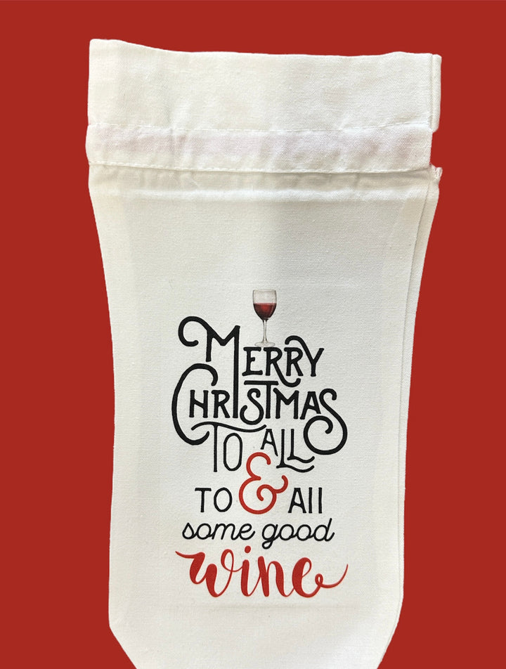 Off-white, USA-designed holiday wine bottle bag featuring a wine glass icon and the text “Merry Christmas to all &amp; to all some good wine.”.