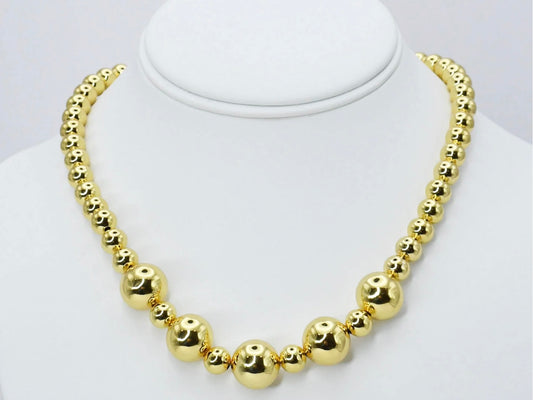 Golden Beads Necklace with shiny gold beads in alternating small and large sizes. Available sizes: small, medium, large.