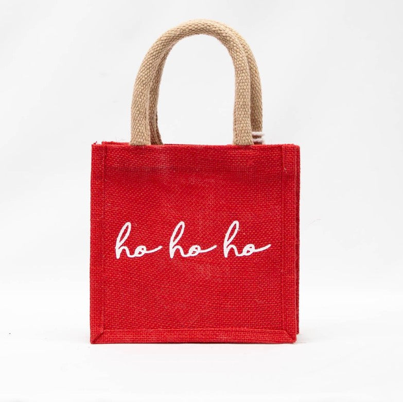 Small square HoHoHo Petite Gift Tote in red with tan handles and white script.