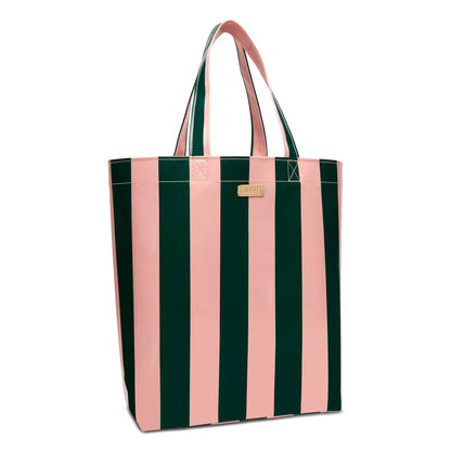 The Grab ‘n’ Go Basic, Fern is a utility tote with vertical pink and dark green stripes, two sturdy handles, a small gold label near the top, made from durable ConsuelaCloth. Available in basic size.