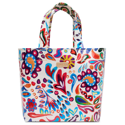 White ConsuelaCloth tote with red, blue, orange, and purple floral paisley print, two handles, gold label. Sizes: Mini.