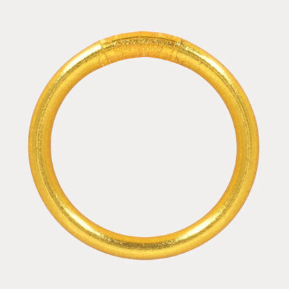 Shiny, smooth, handcrafted circular gold bangle. Available in multiple sizes.