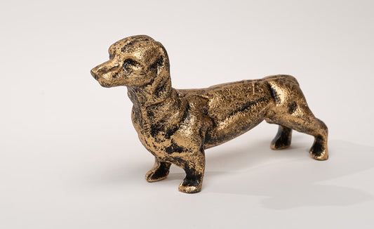 Gold cast iron dachshund paperweight with shiny finish, small size. Available in 4-inch and 6-inch lengths.