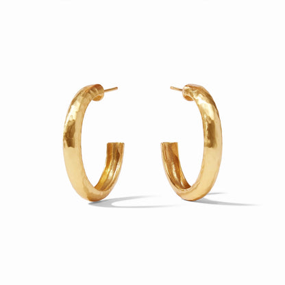 Thick 24k gold hand-hammered hoop earrings with post backings. Available sizes: small, medium, large.