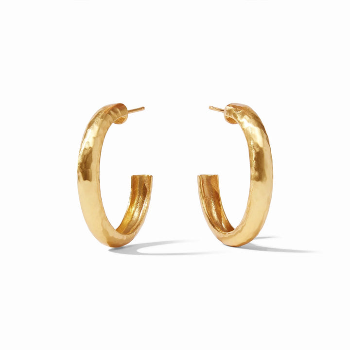 Thick 24k gold hand-hammered hoop earrings with post backings. Available sizes: small, medium, large.