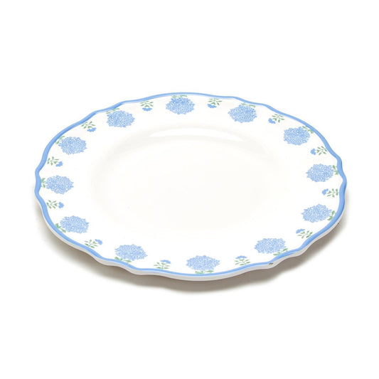White melamine plate with blue floral pattern, scalloped edge, and light blue rim. Dishwasher safe. Available in 11" size.