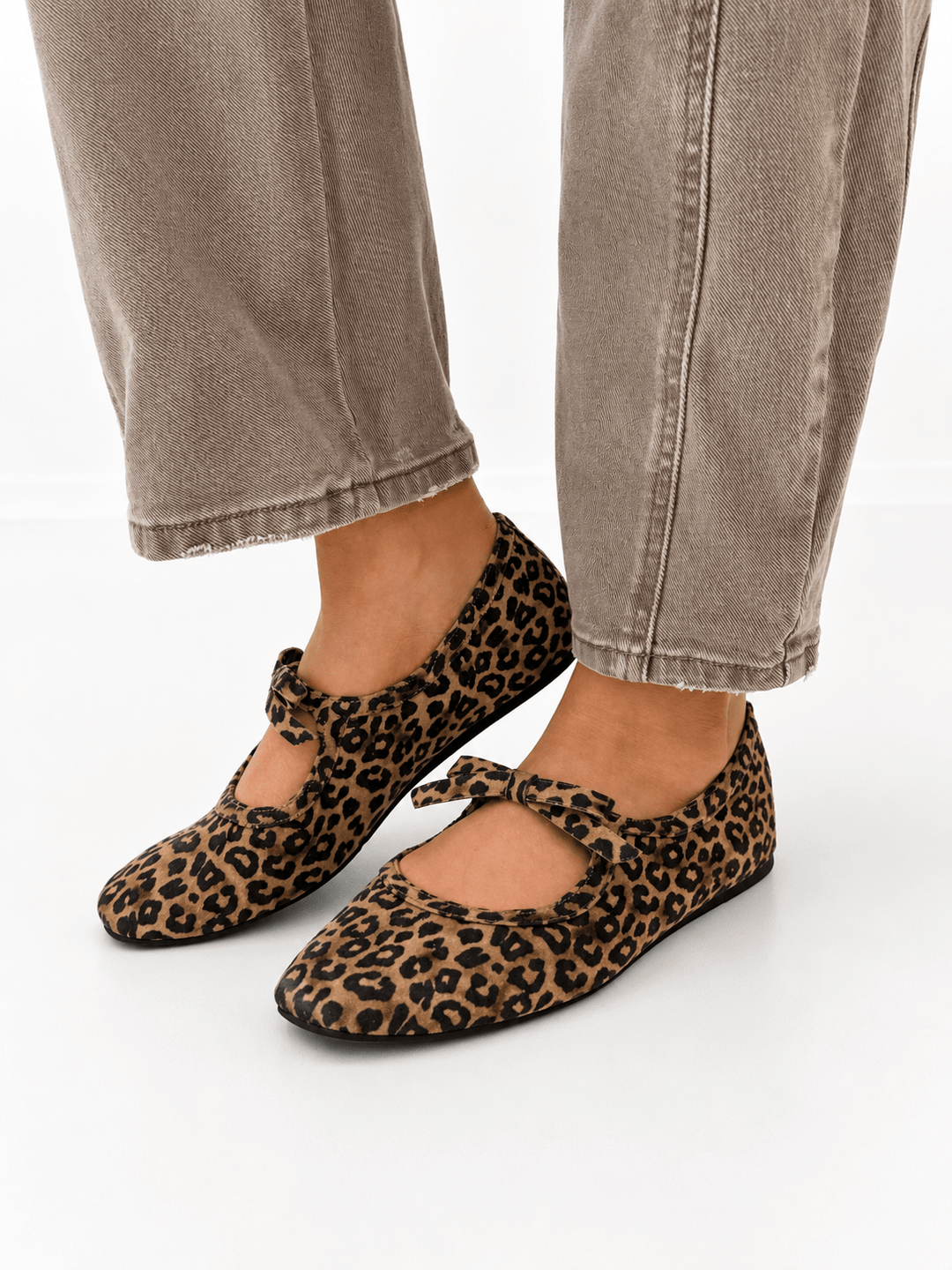 Leopard-print Layover Flat with thin strap and bow.