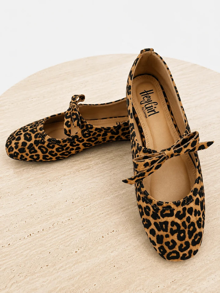 Leopard print Layover Flat With Bow ballet flats featuring a small vamp bow and cushioned footbed. Available in multiple sizes.