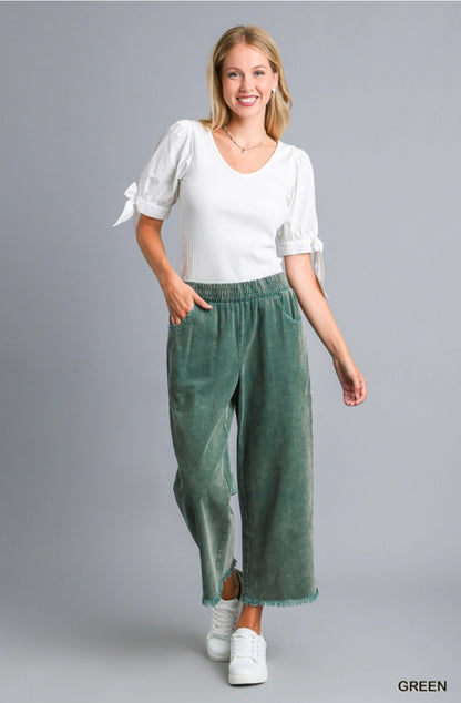 White short-sleeve blouse with tie details, available in XS–XL.