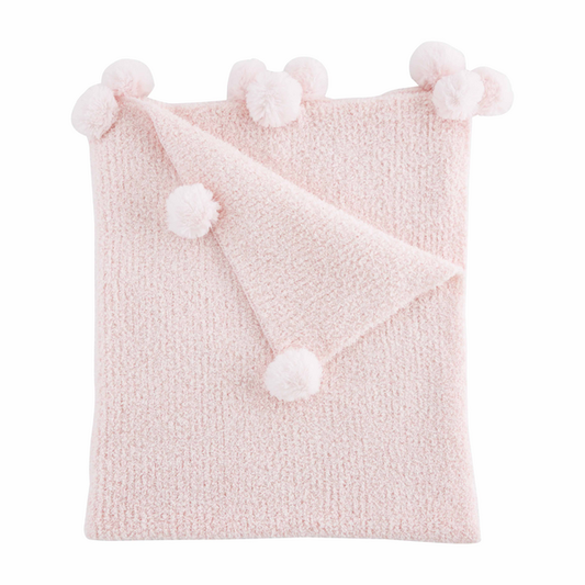 A soft Pink Chenille Blanket with fluffy pompoms on each corner, neatly folded with one corner turned down to showcase the texture and details.