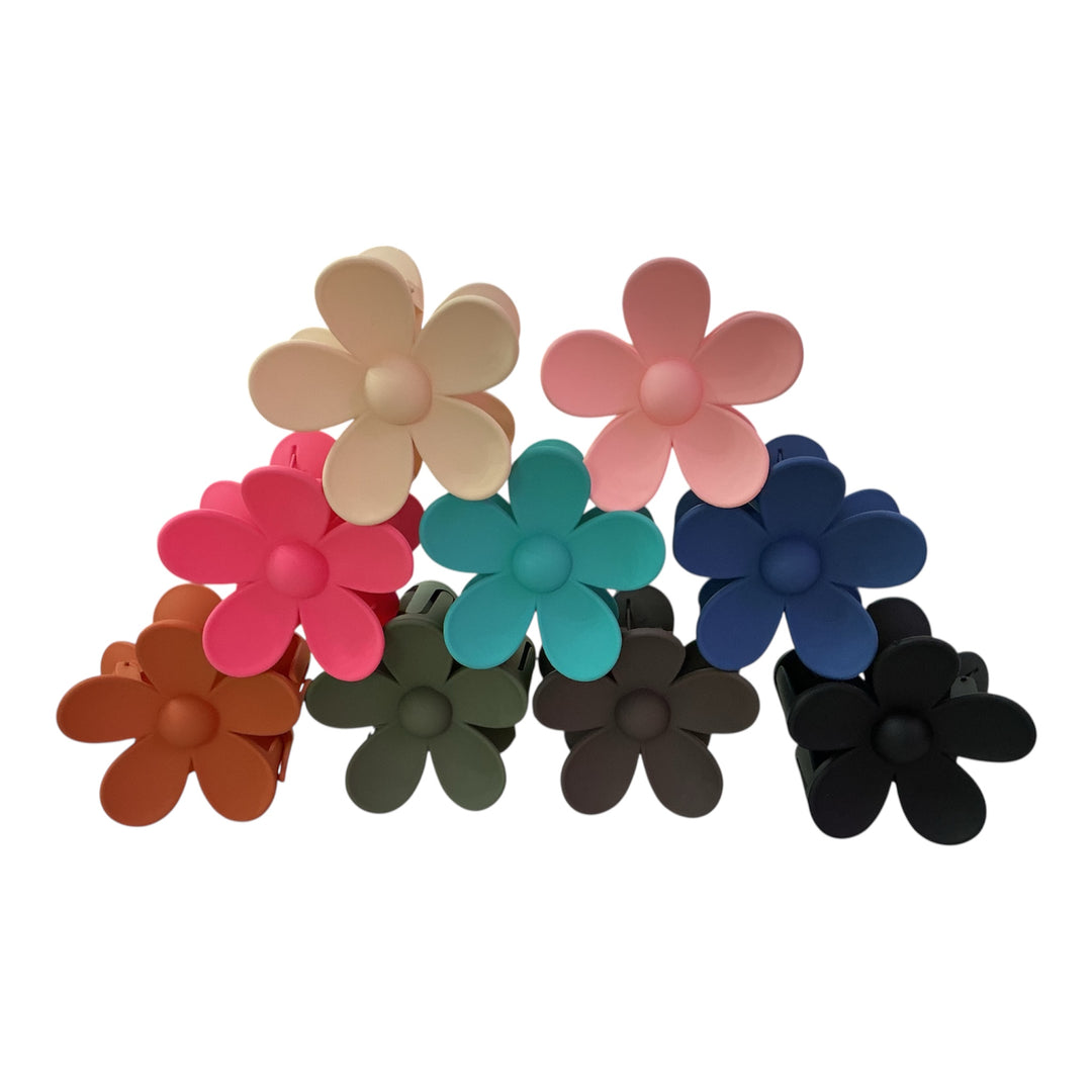 Set of nine flower-shaped hair clips in beige, pink, blue, teal, orange, red, green, brown, and black. Sizes: small/medium.