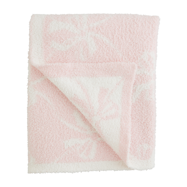 Pink chenille blanket with white bows pattern and white edge trim.