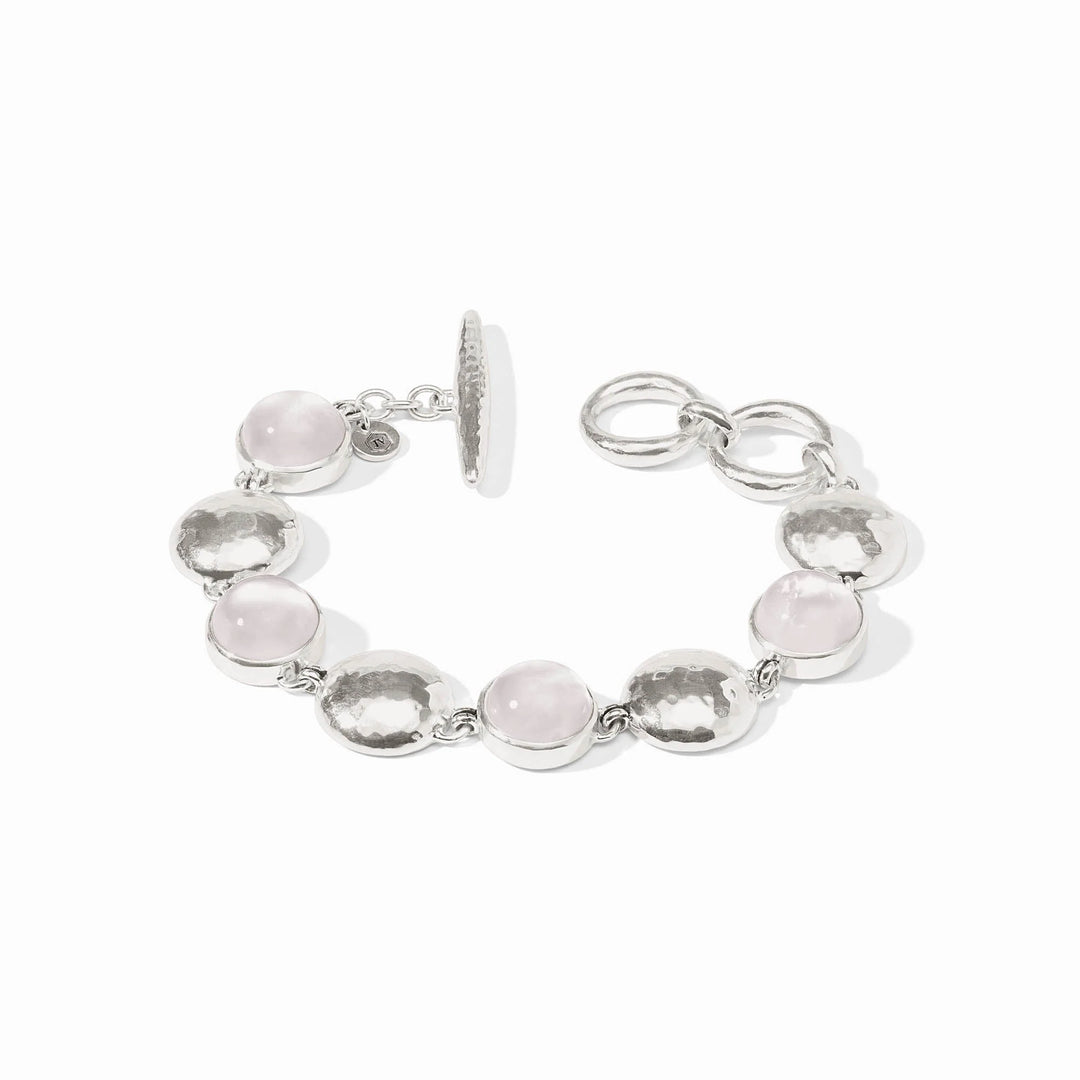 Silver bracelet with rose quartz, iridescent stones, hammered discs, toggle clasp. Available in S, M, L.