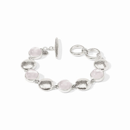 Silver bracelet with rose quartz, iridescent stones, hammered discs, toggle clasp. Available in S, M, L.