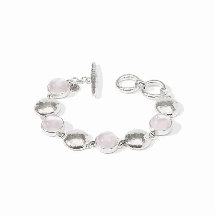 Silver bracelet with rose quartz, iridescent stones, hammered discs, toggle clasp. Available in S, M, L.