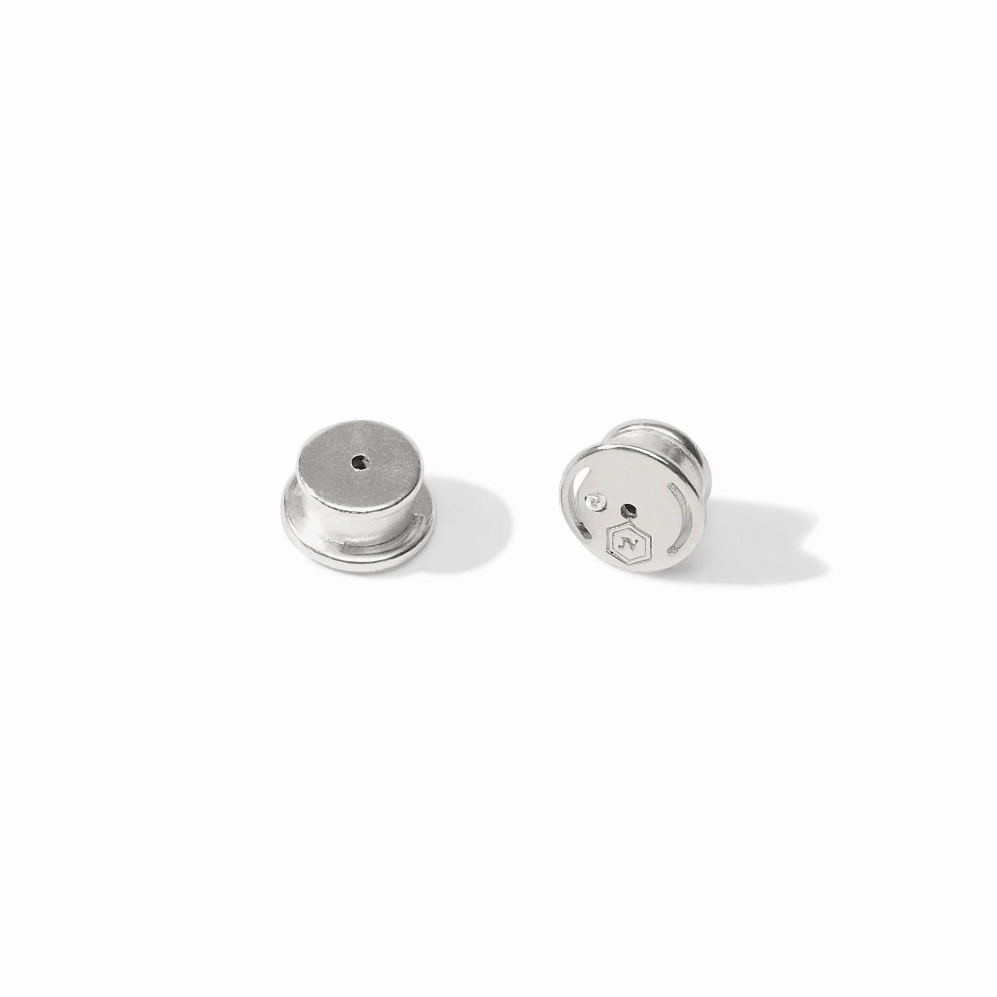 The Solara Earring - Silver: small, round earrings with flat tops, grooved sides, arrow and N design. Available in multiple sizes.