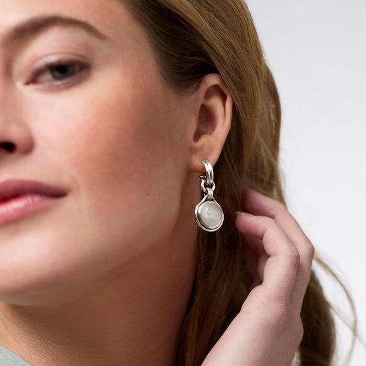 Solara Hoop & Charm Earring in Silver Iridescent Montana Blue features a silver hoop and blue charm; available in S, M, L.