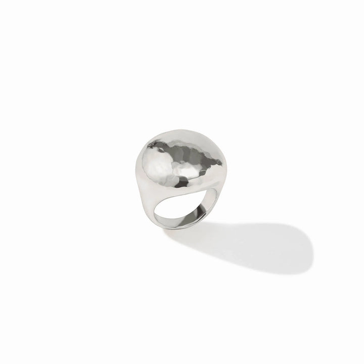 The Solara Ring Silver has a domed shape, hammered texture, and starburst engraving. Available in sizes 5–9.