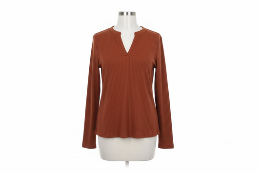 Burnt orange V-neck longsleeve with ribbed, textured fabric and split neckline. Available in sizes S-XL.