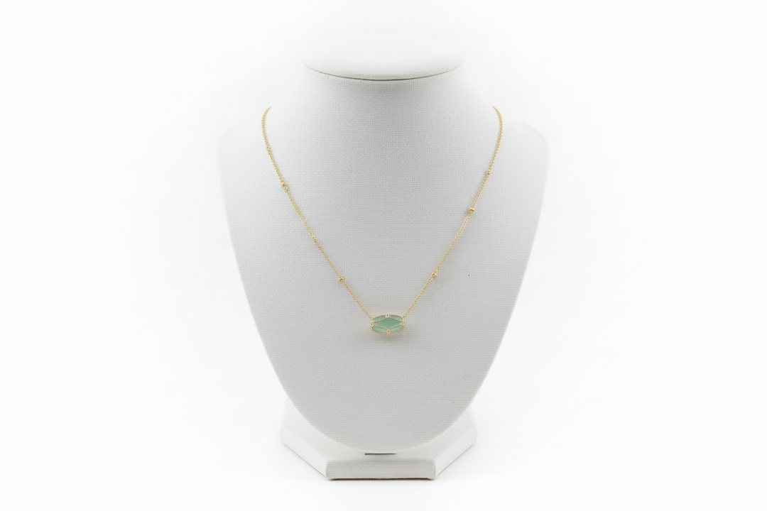 Elisa Lattice Gold Frame necklace by Kendra Scott with a round green gemstone in a gold setting. Available in 16" and 18".