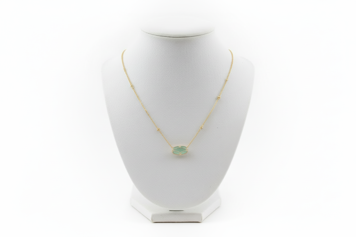 Elisa Lattice Gold Frame necklace by Kendra Scott with a round green gemstone in a gold setting. Available in 16" and 18".