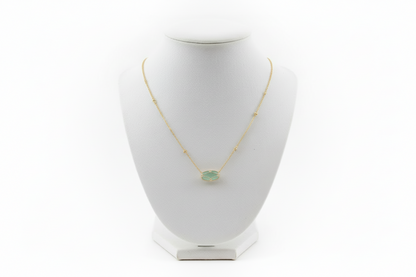Elisa Lattice Gold Frame necklace by Kendra Scott with a round green gemstone in a gold setting. Available in 16" and 18".