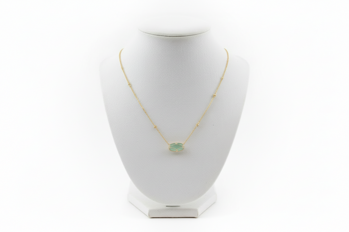 Elisa Lattice Gold Frame necklace by Kendra Scott with a round green gemstone in a gold setting. Available in 16" and 18".