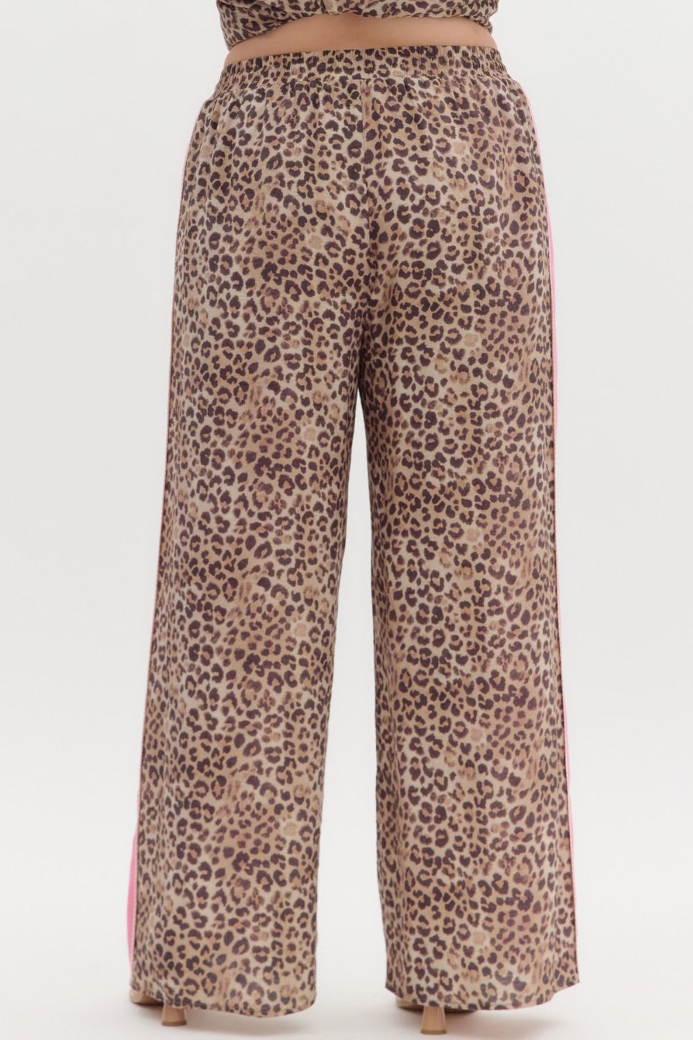 Leopard Print Pants with Pink Stripe, relaxed fit, high waist, wide legs, adjustable waistband. Sizes: XS–XL.