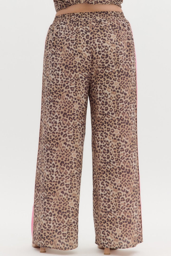 Leopard Print Pants with Pink Stripe, relaxed fit, high waist, wide legs, adjustable waistband. Sizes: XS–XL.