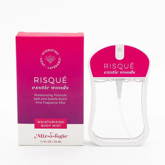 Pink and white "Risqué Exotic Woods Moisturizing Body Mist" box and spray bottle. Available in 3.4 oz size.