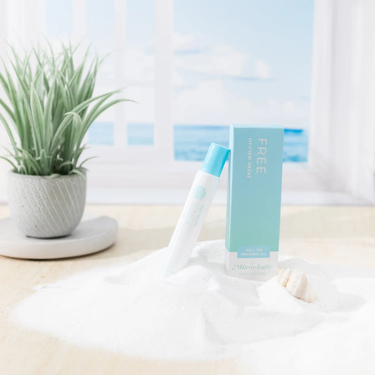 The Free Perfume Oil Roll On by Mix O Logie in compact blue and white packaging; available in travel size.