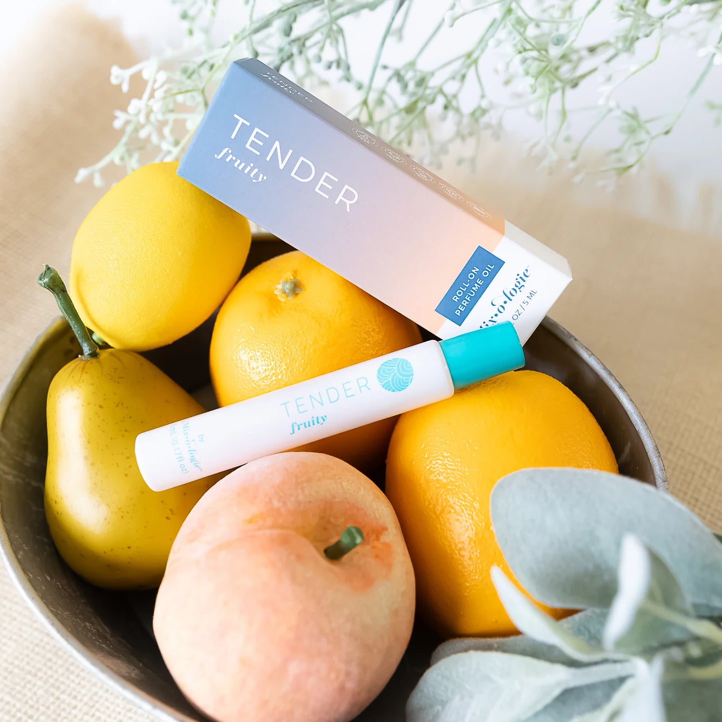 Tender Perfume Oil Roll On by Mix O Logie, white and turquoise bottle with box, available in multiple sizes.